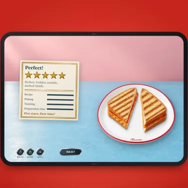 Toastie Turns the iPhone Duo's Fold Into a Tiny Grilled Cheese Game